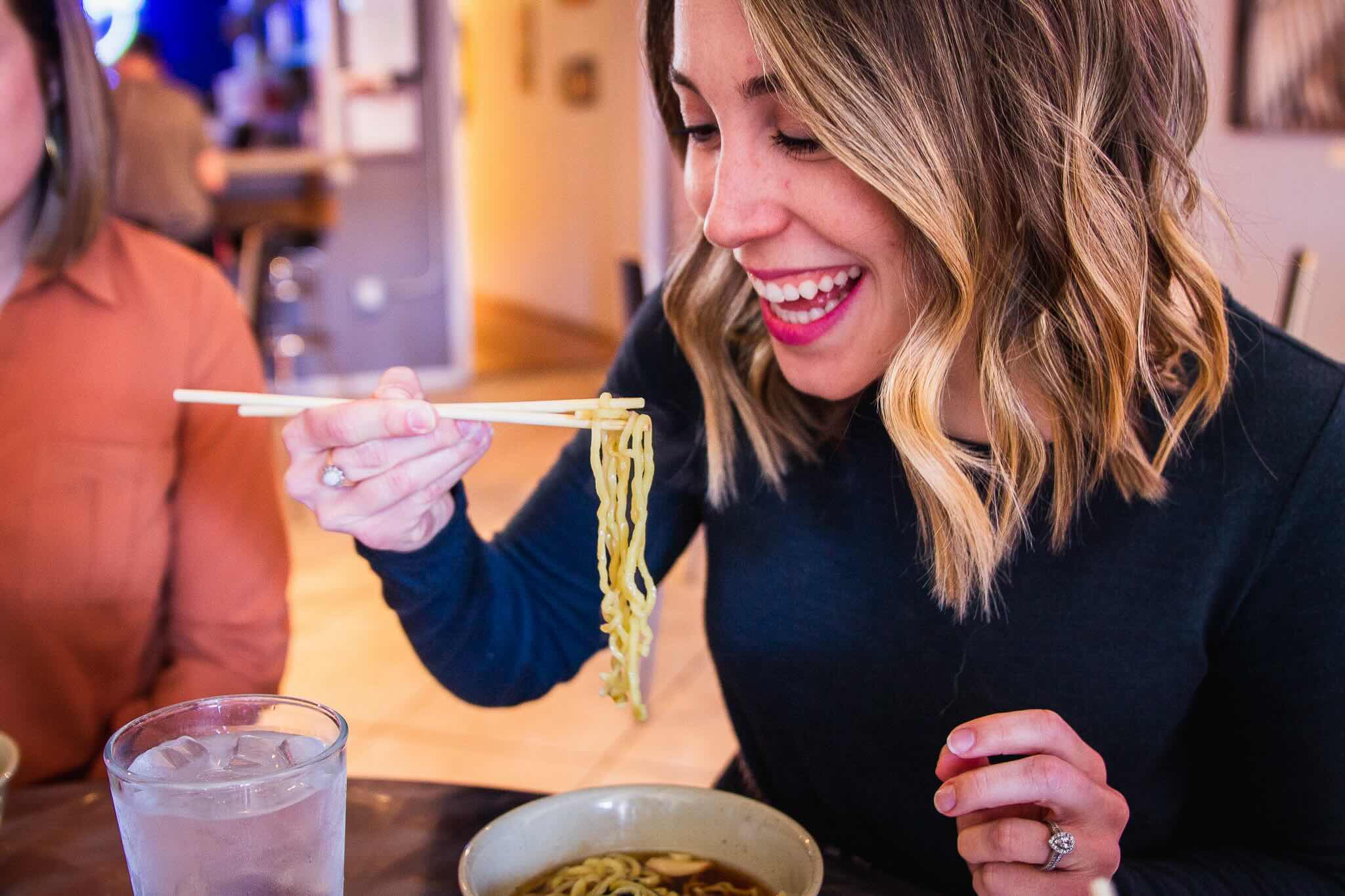 Guest enjoying a bowl of ramen on a Colorado Springs food tour